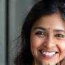 Portrait photo of Priya Sharma smiling.